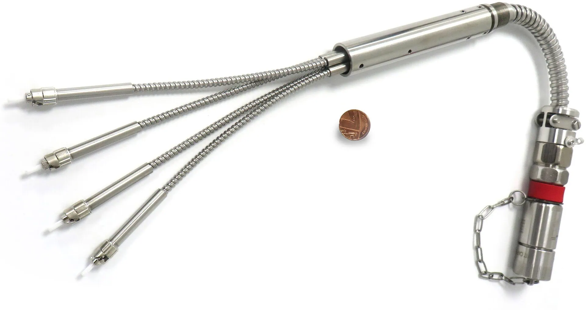 Armoured multi-leg fibre optic cable assembly by Alker, shown with penny for size reference