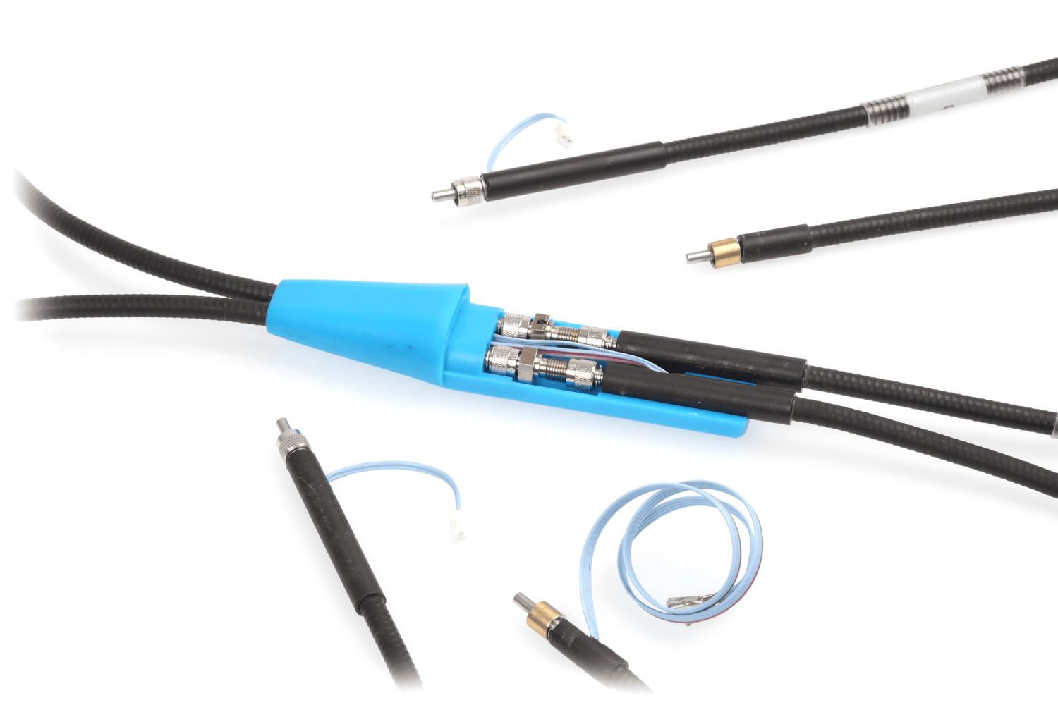 A detailed product shot showing a black cable splitting into two within a light blue plastic housing. Several other specialized terminated cables and a coiled wire are also visible on a white background.